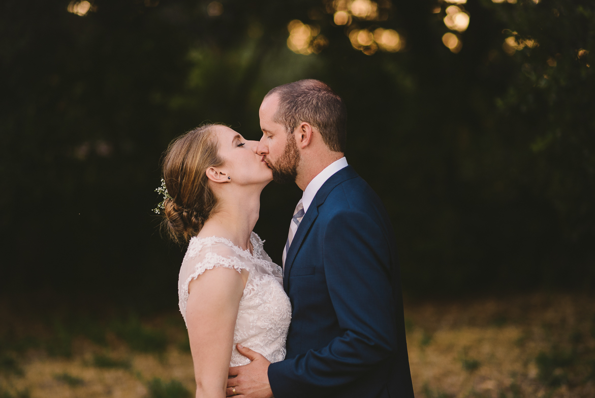 Bride and groom kissing on wedding day travel photography